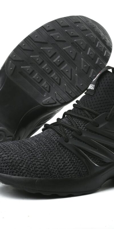 Stylish black running sneakers showcased on a minimalistic white background.