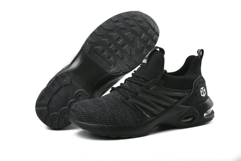 Stylish black running sneakers showcased on a minimalistic white background.